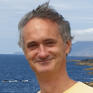 An tOllamh Tadhg &Oacute; hIfearn&aacute;in, BA, PhD (Ulster University)