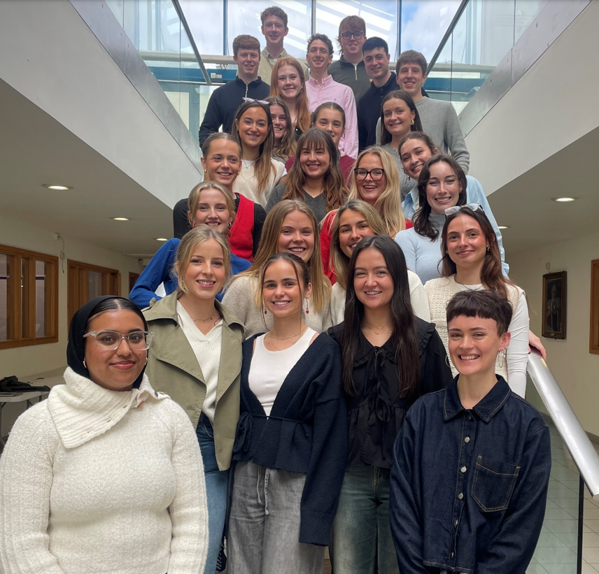 students standing on stairs