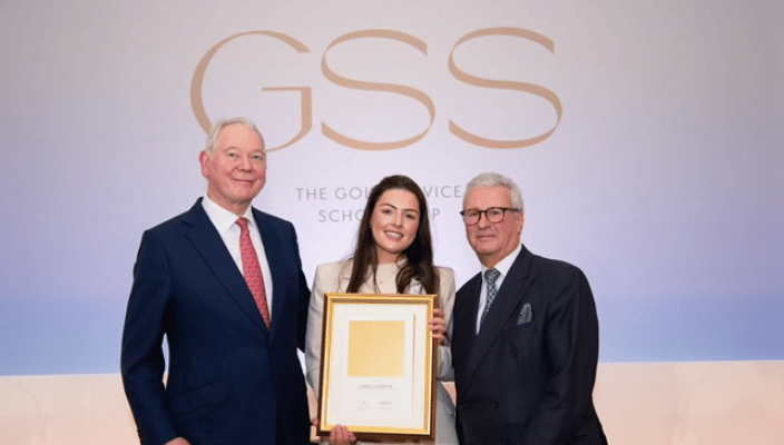 Isabelle Condon, Shannon Graduate, holding winning frame being recognised as gold scholarship winner