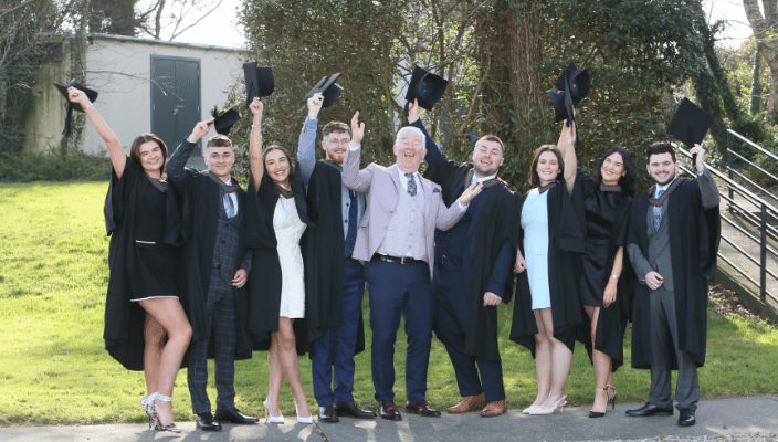 the graduating class of 2025 smiling with their patron