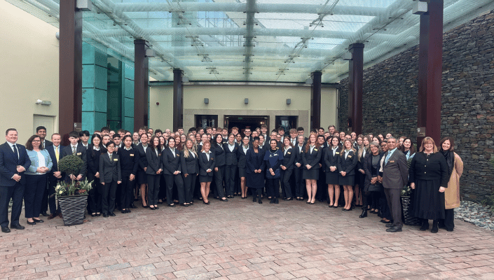 students outside hotel on industry trip 