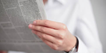 Image of a man holding a report