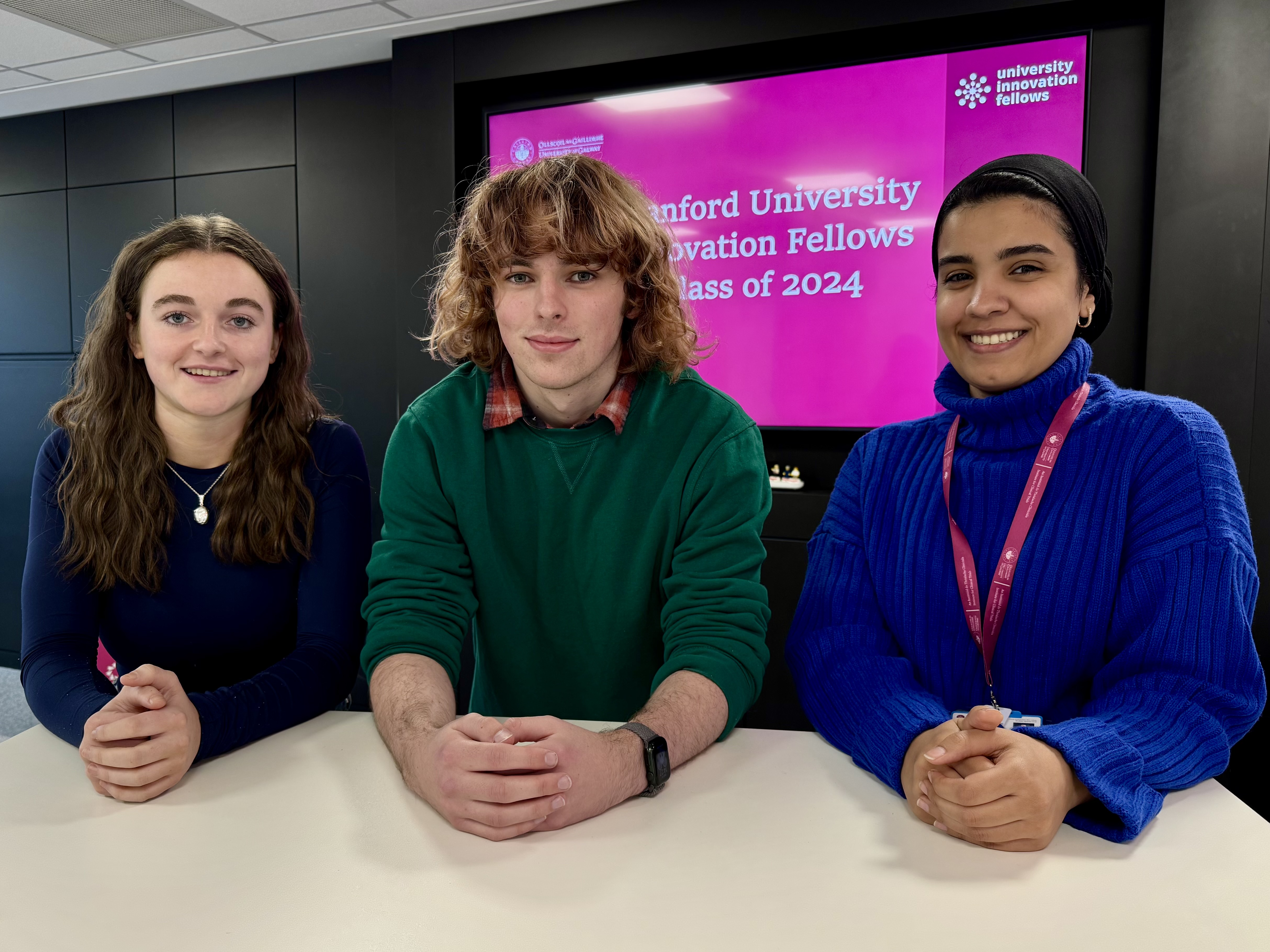 Three students smiling to camera in IdeasLab